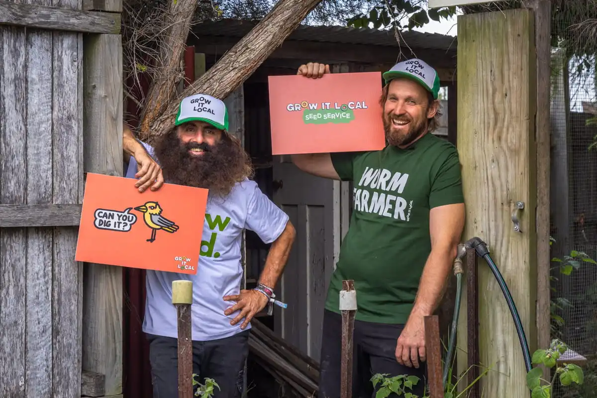 Grow it local gardeners holding signs